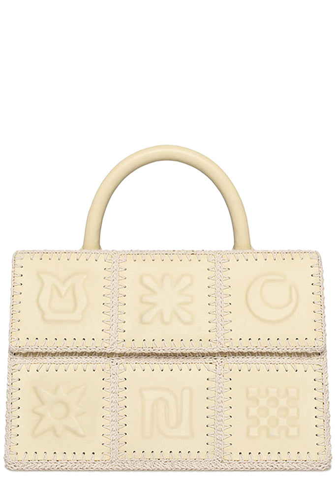Nanushka handbag in beige from pieces with forms sewn together, shown against a plain white background.