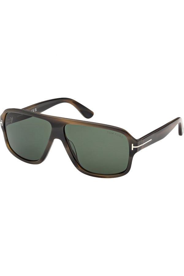 Rotated view of Tom Ford moto sunglasses in green with tortoise frame and metal T details, shown against a plaid white background.