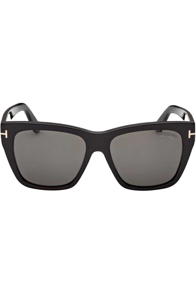 Tom Ford rectangular sunglasses in gray with black frame and metal T details, shown against a plaid white background.