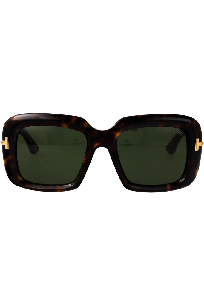 Tom Ford butterfly sunglasses in green with dark tortoise frame and gold T details, shown against a plaid white background.