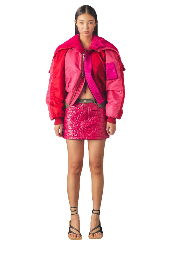 Model wearing the Kamila contrast-panel shearling-collar cropped jacket in pink color from the brand ANDERSSON BELL