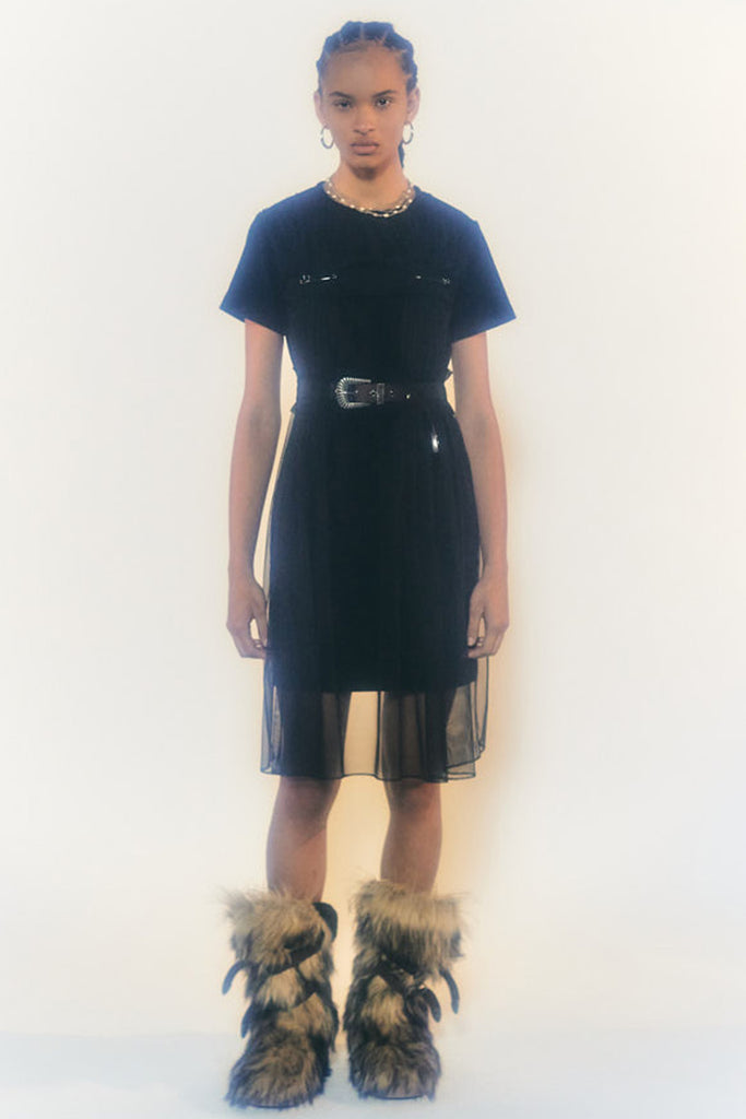 Model wearing the Vlada belted mesh and velvet dress in black color from the brand ANDERSSON BELL