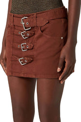 Model wearing the multi belt-detail mini skirt in camel color from the brand BLUMARINE
