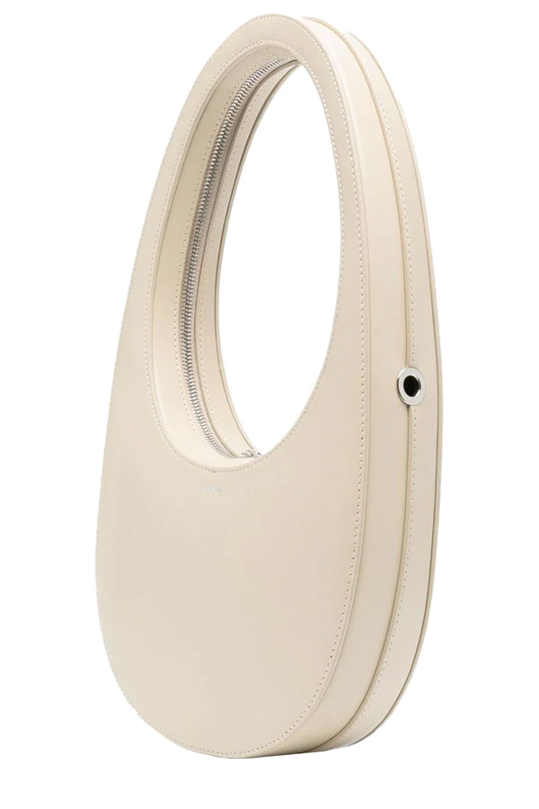 The crossbody Swipe leather bag in the colour sand by the brand COPERNI