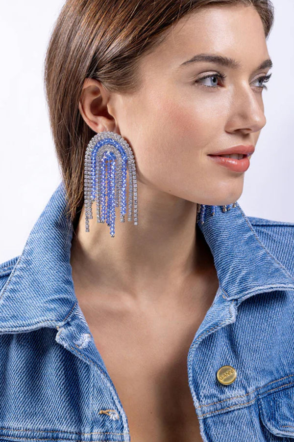 Model wearing the Santorini crystal stud earrings in silver colour from the brand CRYSTAL HAZE