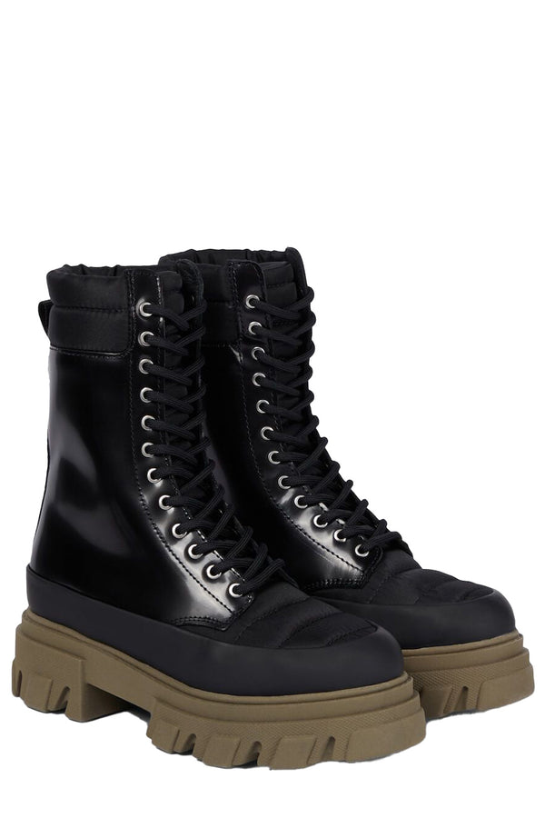 The combat boots in black and army green color from the brand GANNI.