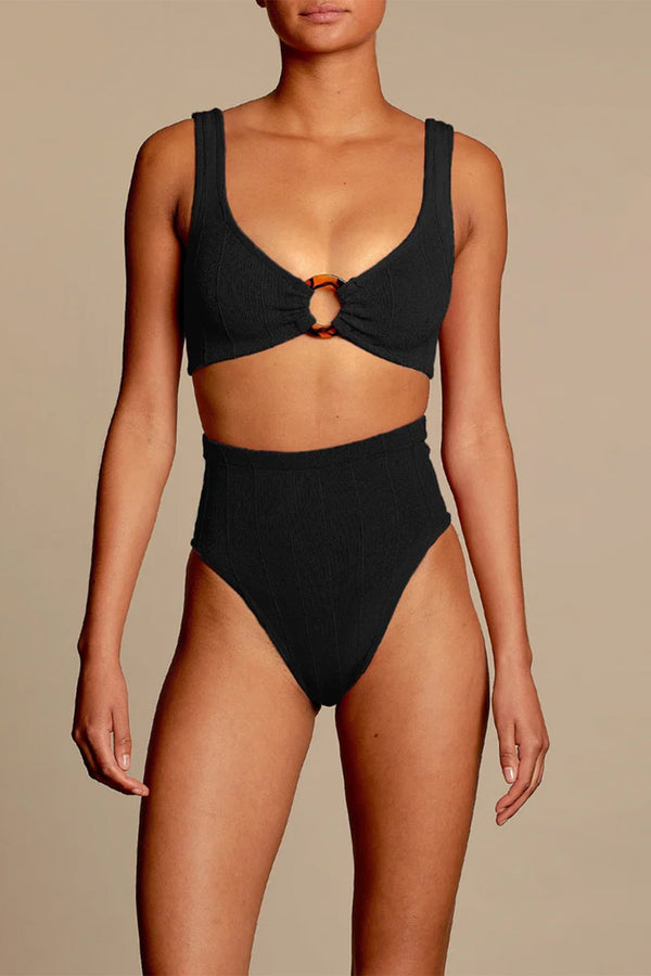 Model wearing the Nadine Ring-Detail High-Rise Bikini in black colour from the brand HUNZA G