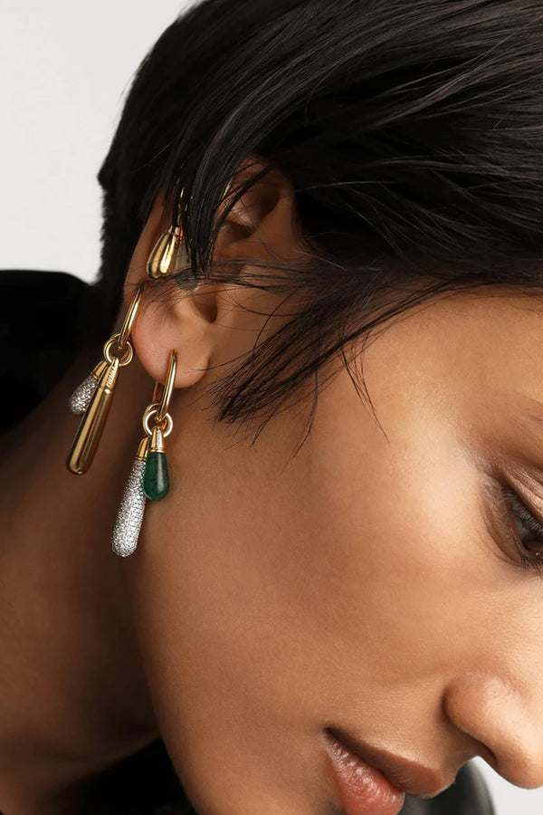 Model wearing the large Jupiter Single hoop earring in gold colour from the brand P D PAOLA