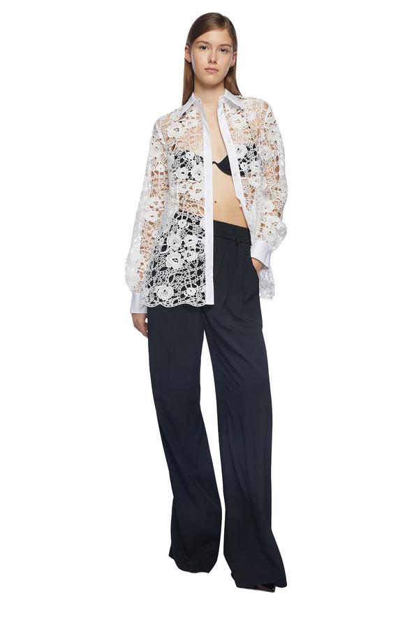 Model wearing the Oversize Wide-Cuff Lace Shirt in off white colour from the brand VIVETTA